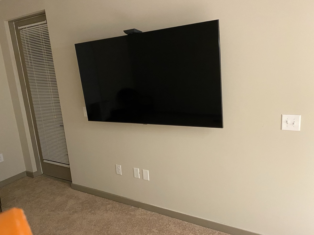 TV mounted above a fireplace